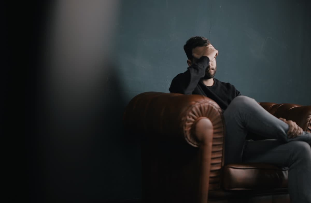 Person going through relationship crisis seeking hotline support for breakup and separation