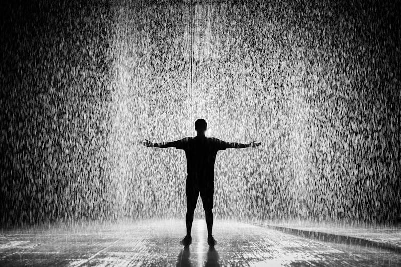 Why Does Heartbreak Hurt So Damn Much? Rain on window representing the pain of heartbreak